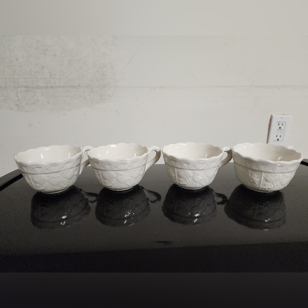 Set of Four White Embossed Teacups